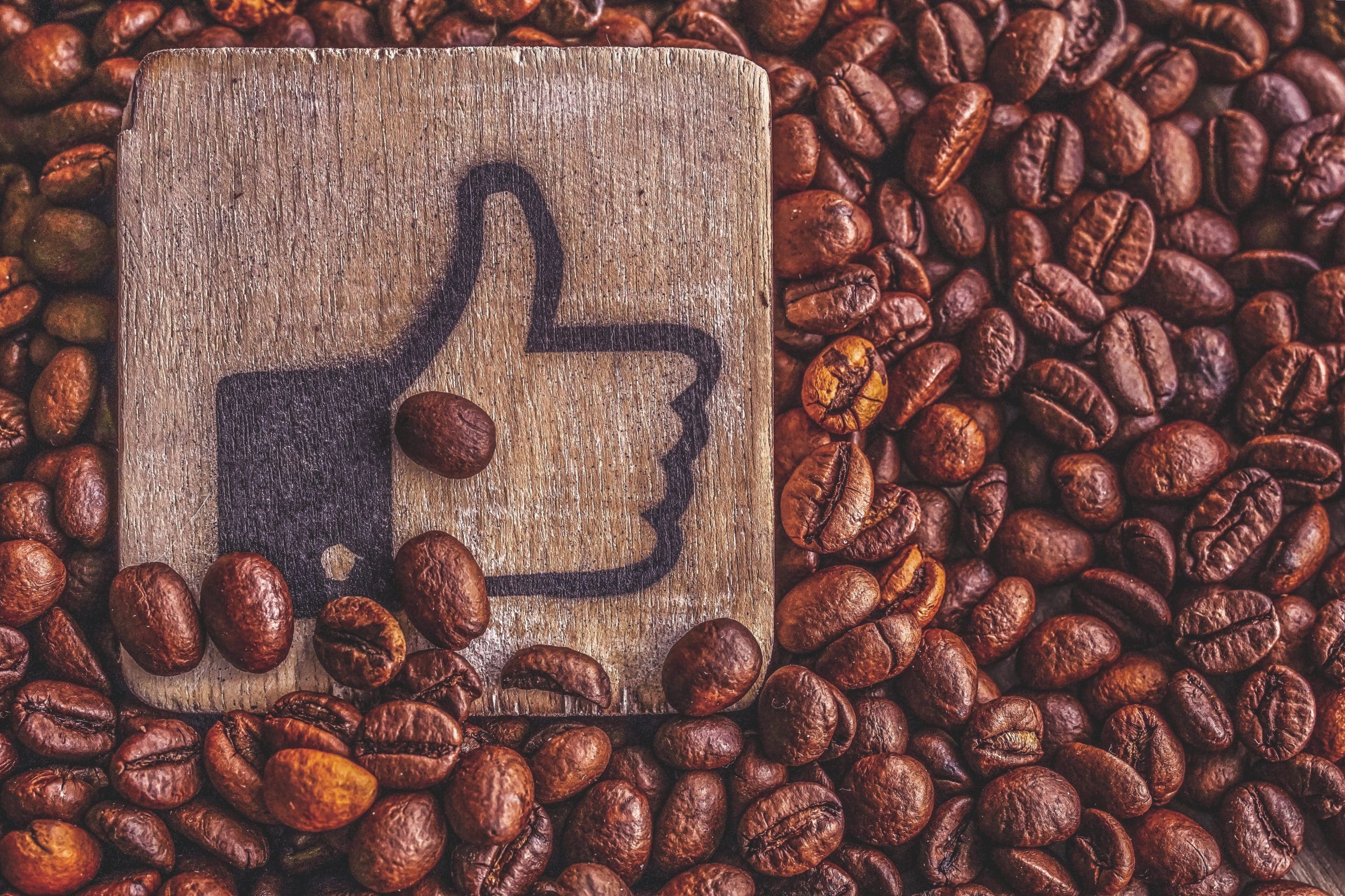 thumb up emoji on coffee beans