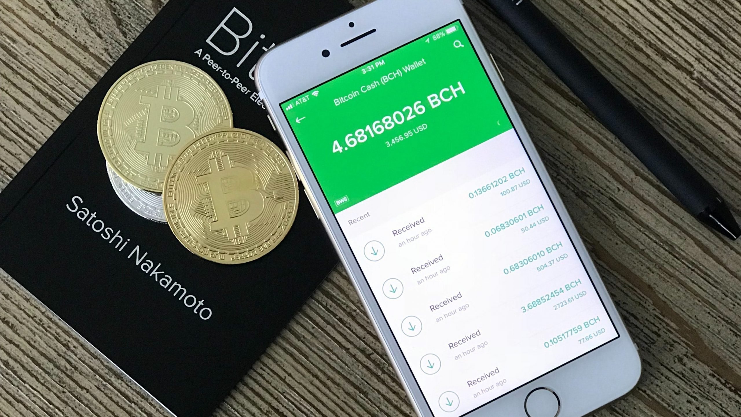 smartphone next to Bitcoin