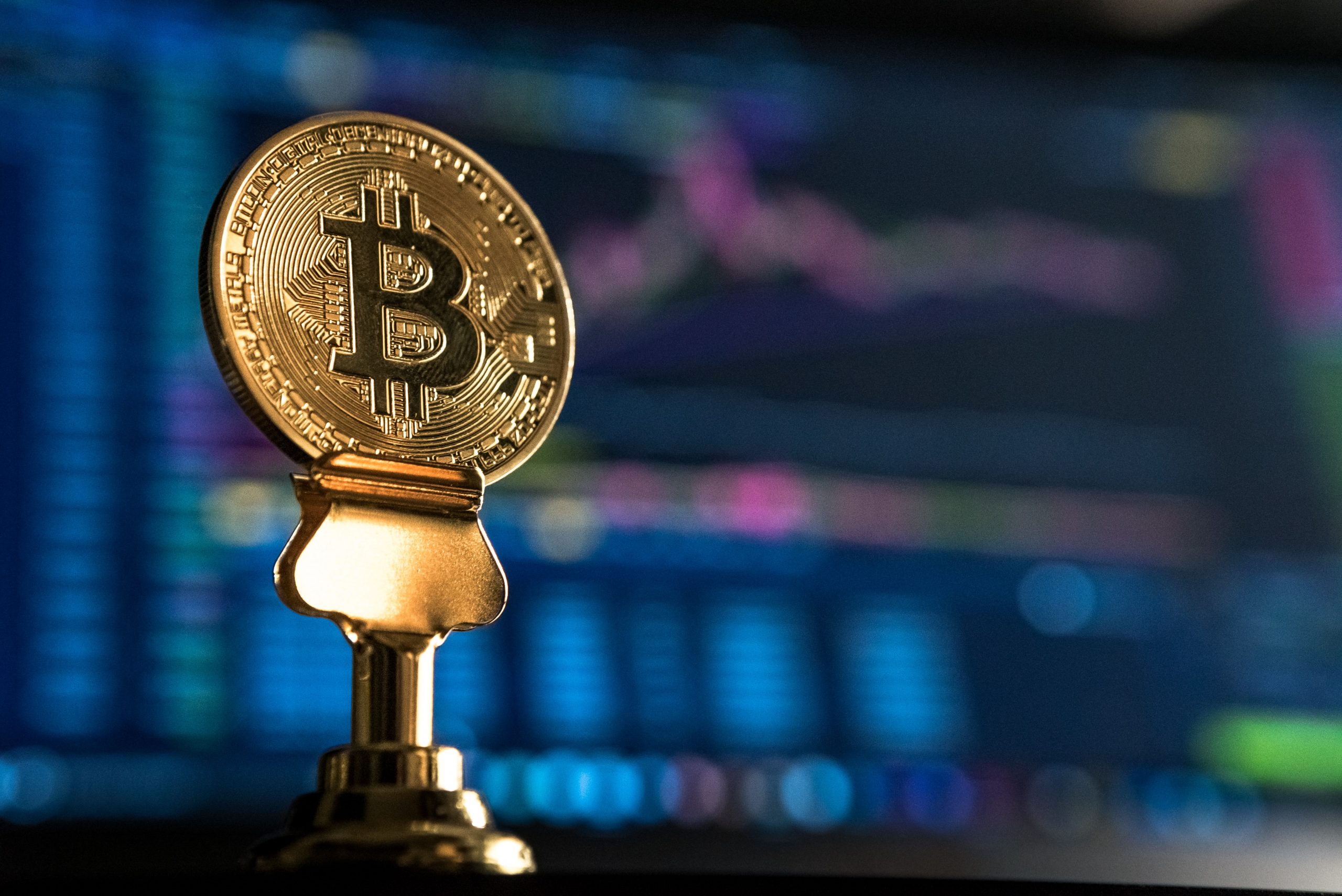 Bitcoin in front of a monitor